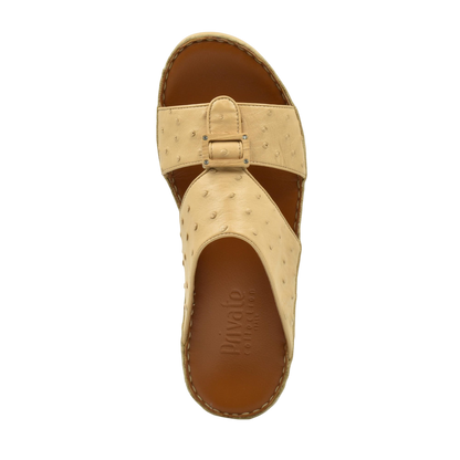 Top view of handcrafted olive sandals with beige textured straps and brown cushioned sole