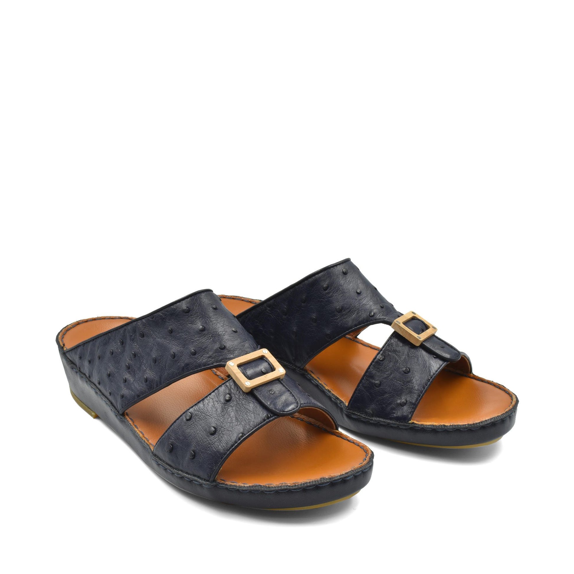 Black leather slide sandals with textured finish and gold buckle detail from handcrafted olive sandals collection