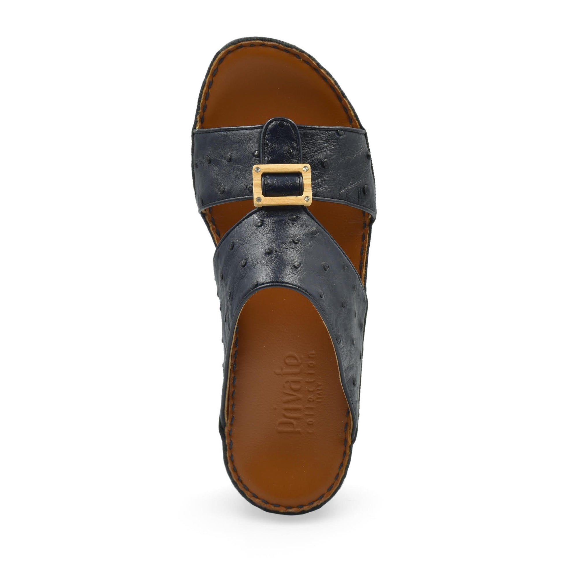 Handcrafted olive sandals in black leather with buckle detail and brown cushioned sole