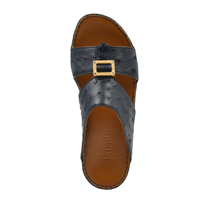 Handcrafted olive sandals in black leather with buckle detail and brown cushioned sole