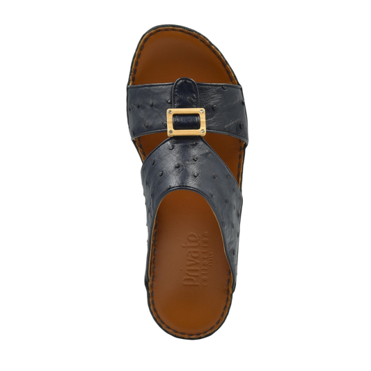 Handcrafted olive sandals in black leather with buckle detail and brown cushioned sole