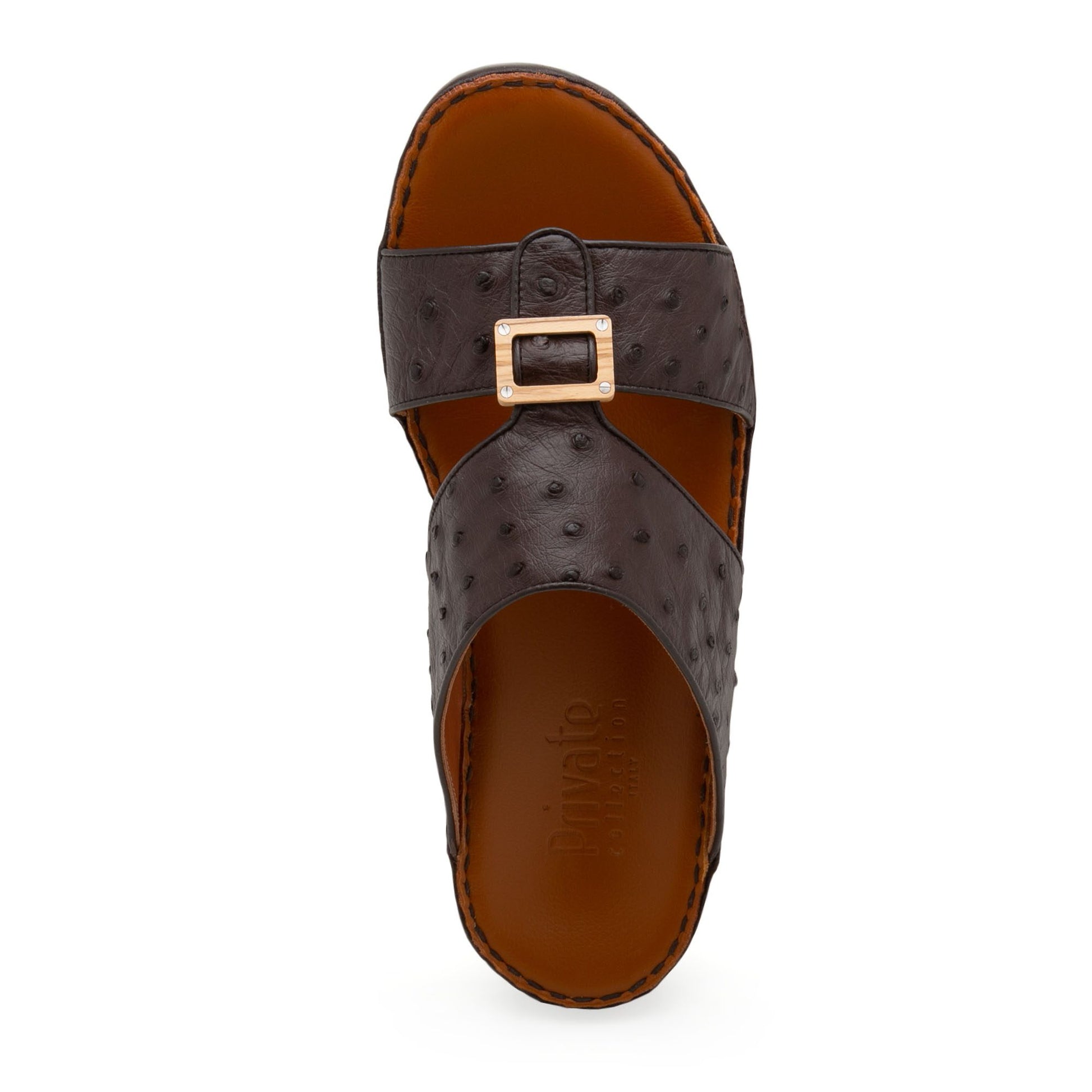 Top view of handcrafted olive sandals with brown textured leather and gold buckle detail