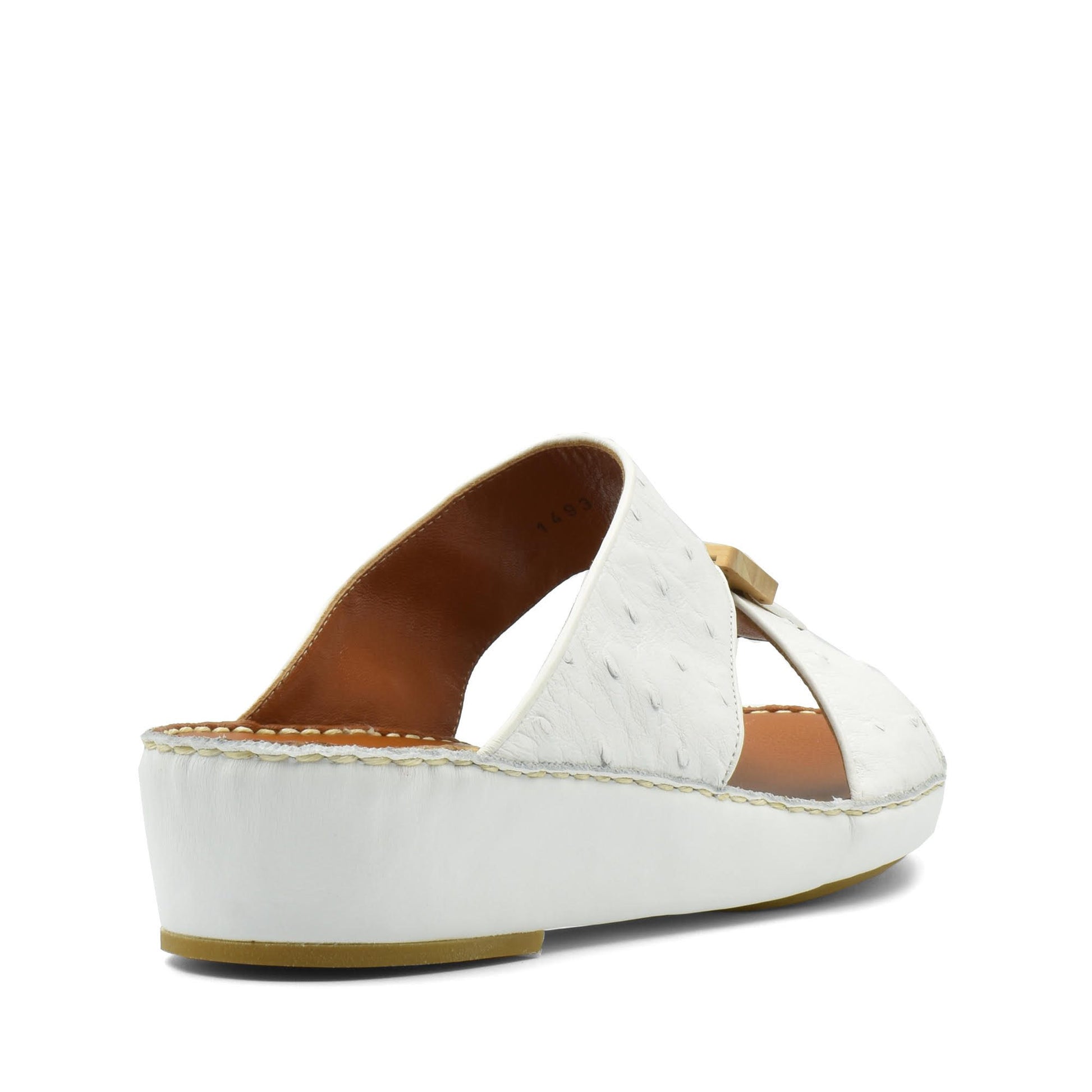 White handcrafted olive sandals with open back and medium wedge heel from Private collection