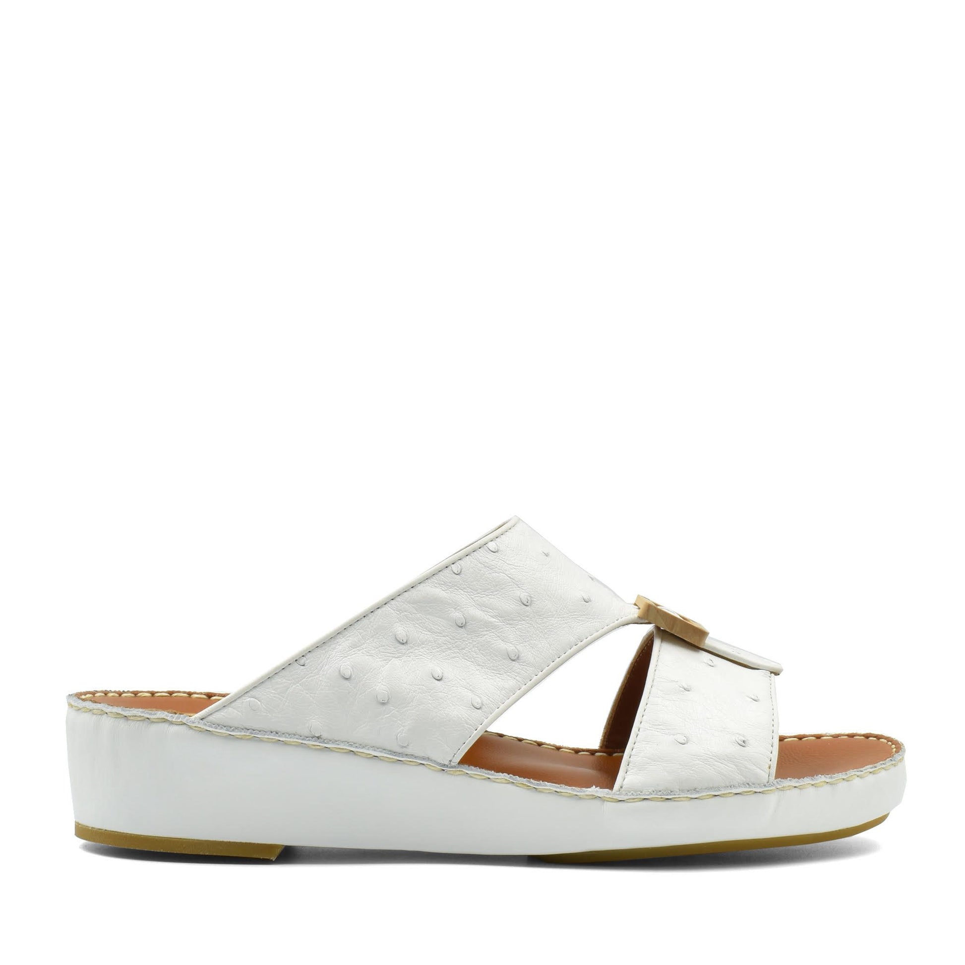 White handcrafted olive sandals with textured leather upper and comfortable cushioned sole