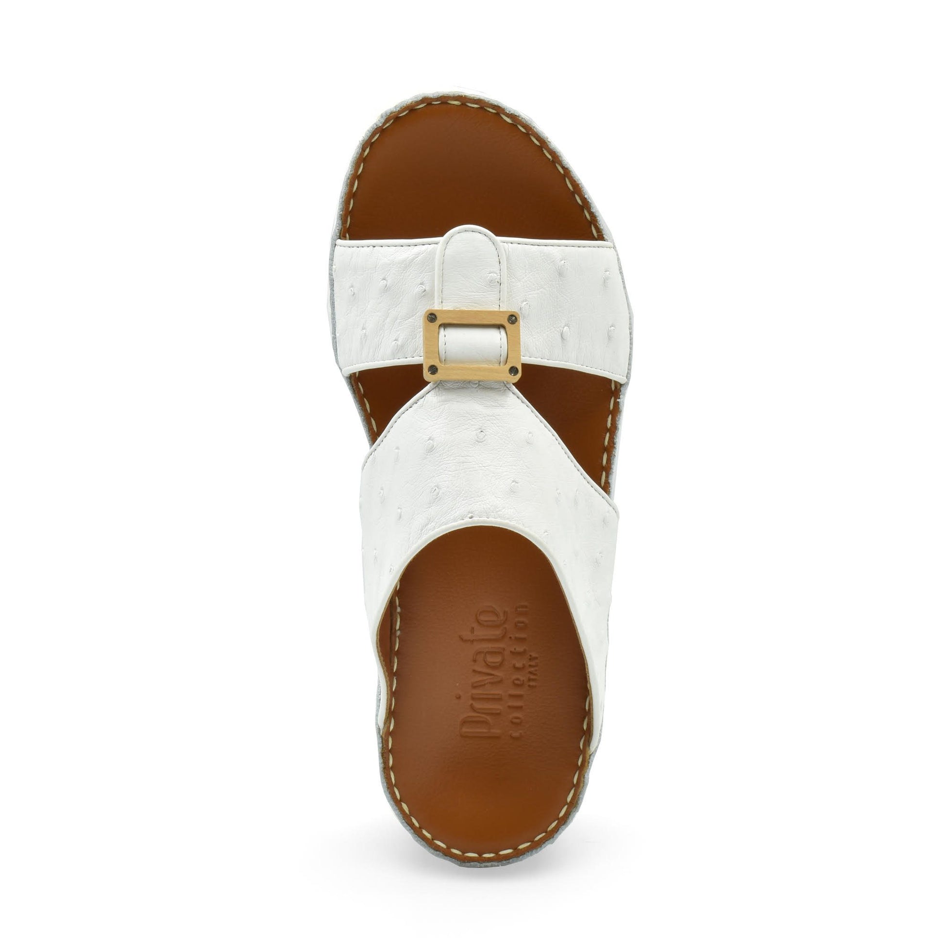 Top view of handcrafted olive sandals with white straps and brown sole by Private Collection