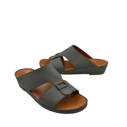 Black Italian leather sandals with buckle detail and cushioned brown footbed from Private collection