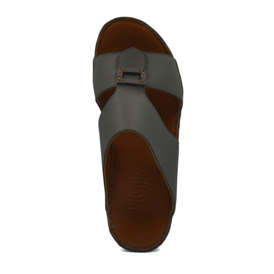 Top view of gray Italian leather sandals with buckle detail and brown insole from private collection