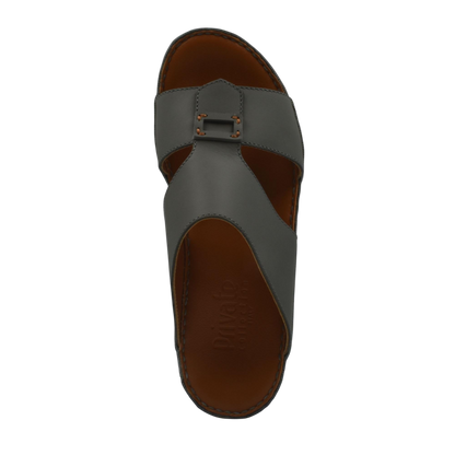 Top view of gray Italian leather sandals with buckle detail and brown insole from private collection