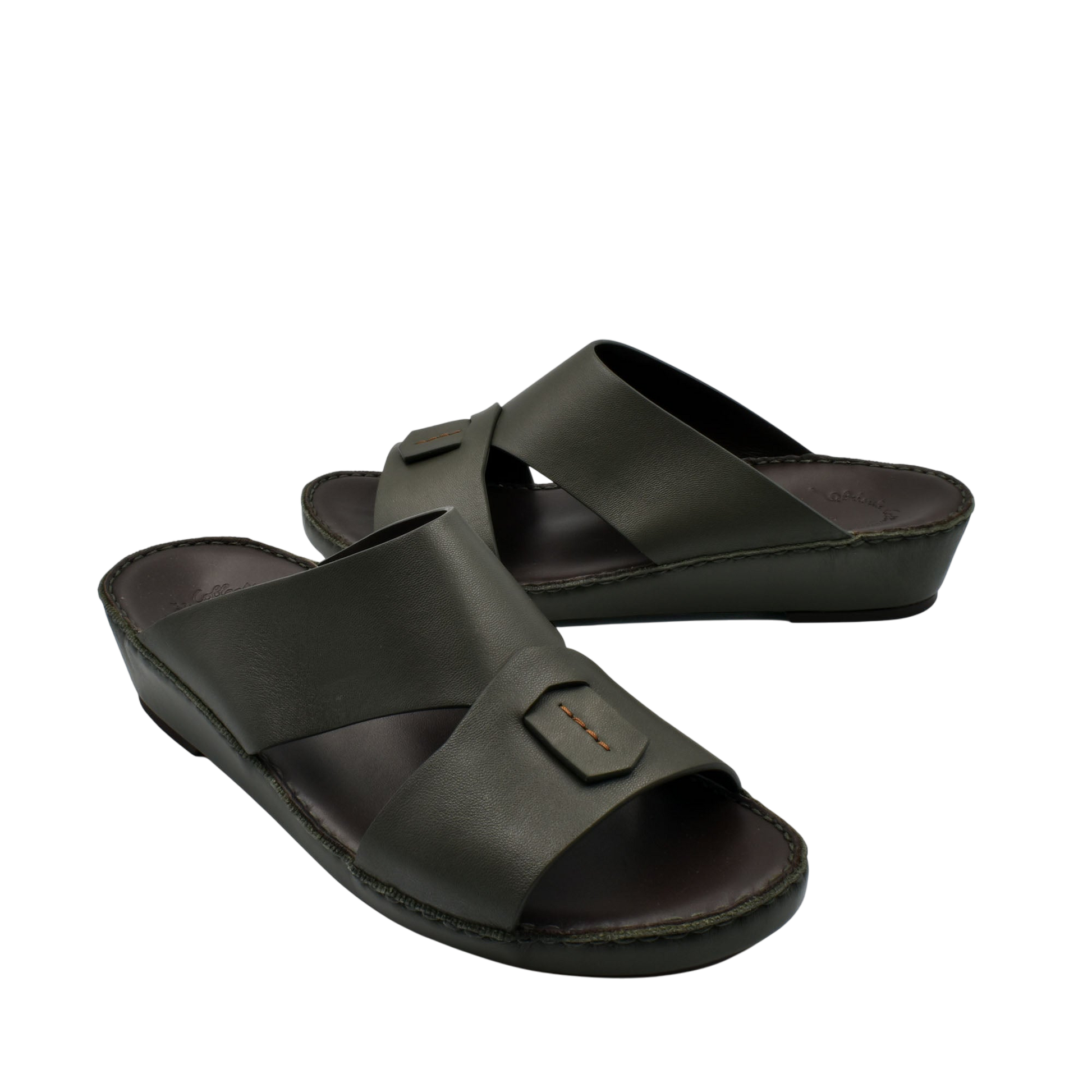 Black Italian nappa sandals with wide cross straps and cushioned footbed in slip-on style