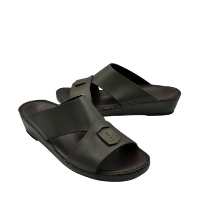 Black Italian nappa sandals with wide cross straps and cushioned footbed in slip-on style