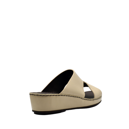 Beige kids leather sandals with open toe and cushioned platform sole from private collection