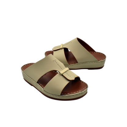 Beige kids rubber calf sandals with adjustable straps and cushioned brown footbed for comfortable wear