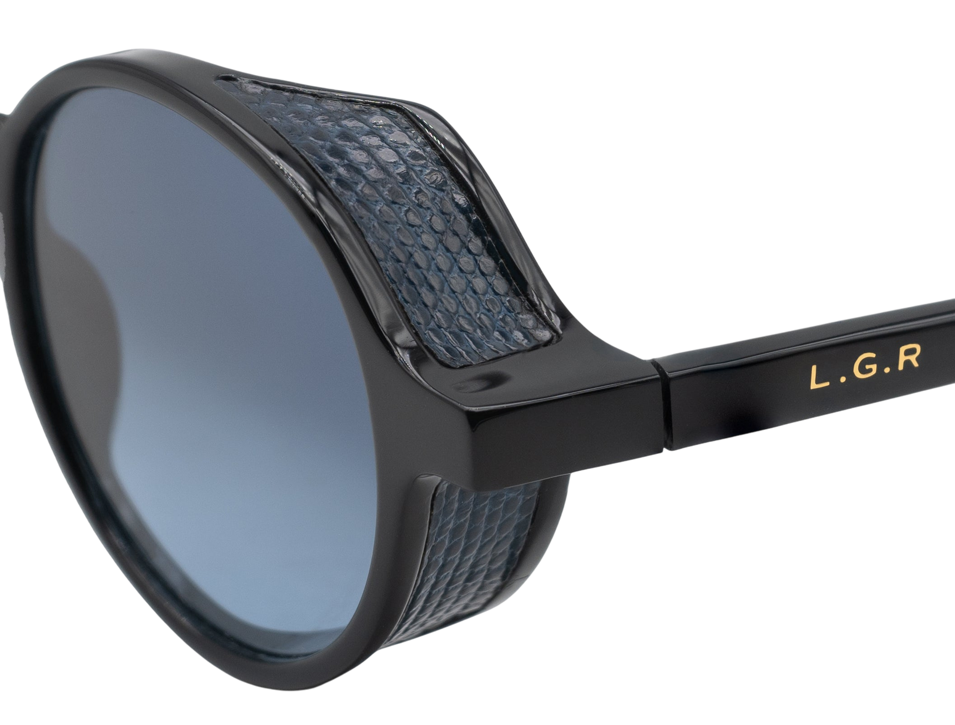 Close-up of black sunglasses with blue textured detailing from a luxury eyewear collection