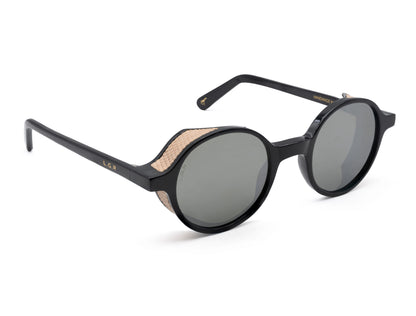 Black round frame luxury sunglasses with textured beige side shields and dark lenses