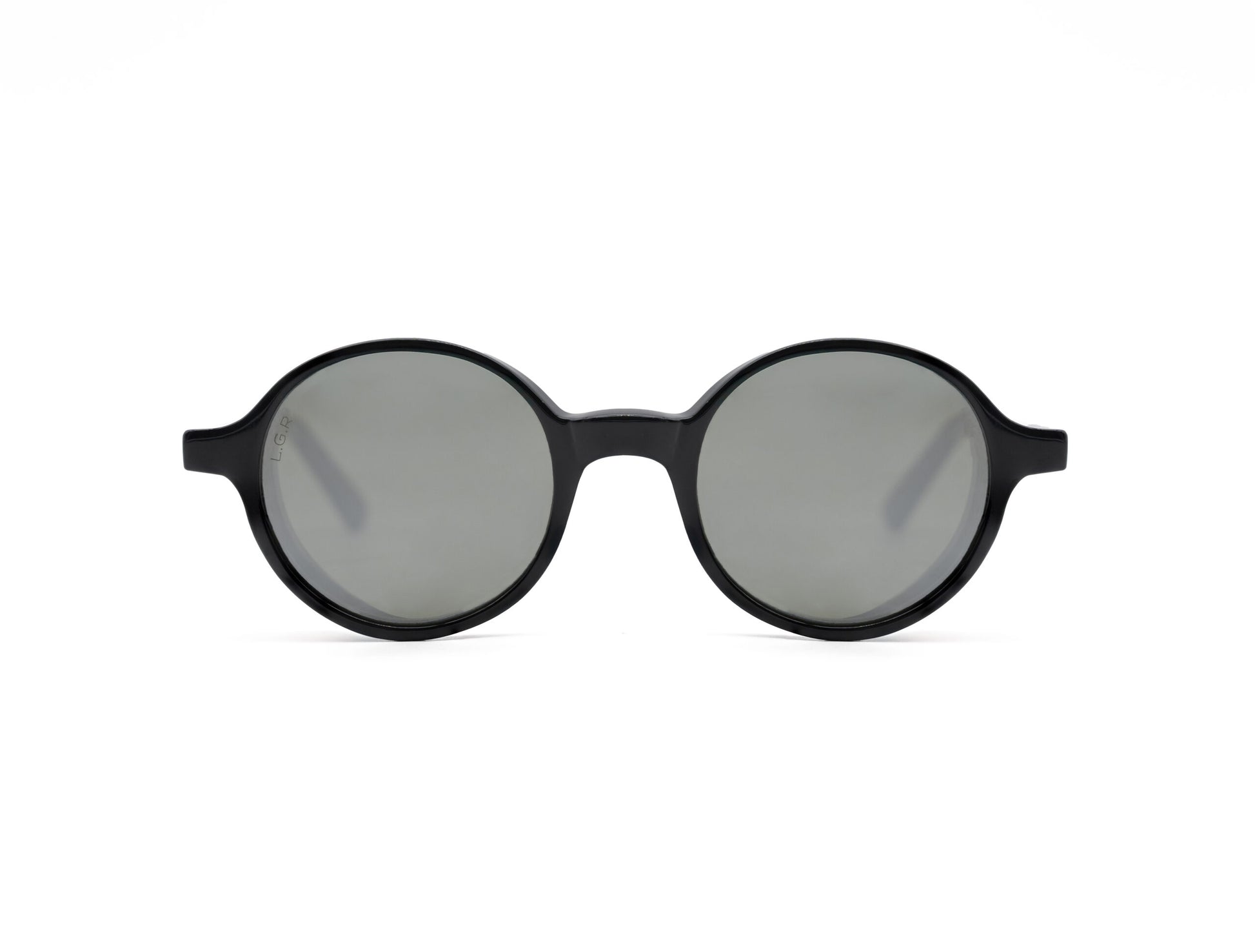 Round frame luxury sunglasses with black frames and gray lenses on white background