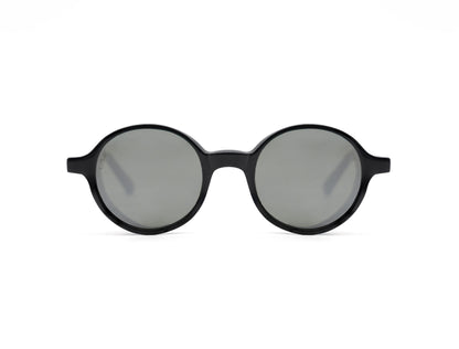 Round frame luxury sunglasses with black frames and gray lenses on white background