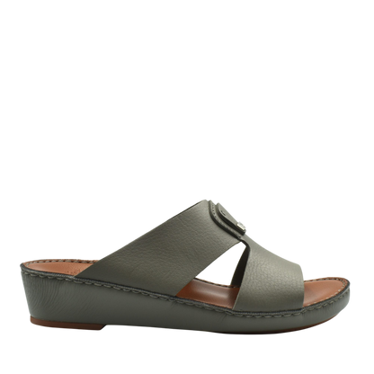 Side view of luxury deercalf sandals in muted green with cushioned sole and open toe design