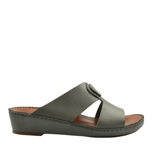 Side view of luxury deercalf sandals in muted green with cushioned sole and open toe design