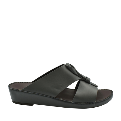 Black luxury leather sandals with a low wedge heel and wide crisscross straps