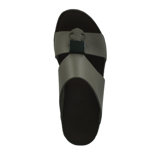 Top view of luxury leather sandals with gray straps and black buckle detail