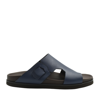 Blue luxury leather sandals with textured straps and cushioned black sole for comfort