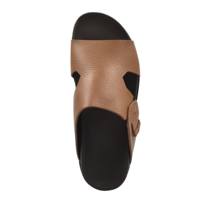 Top view of tan luxury leather sandals with adjustable strap and black sole