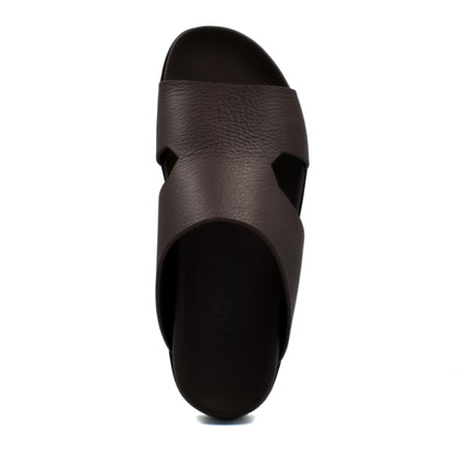 Top view of brown luxury leather sandals with cushioned sole and wide strap design