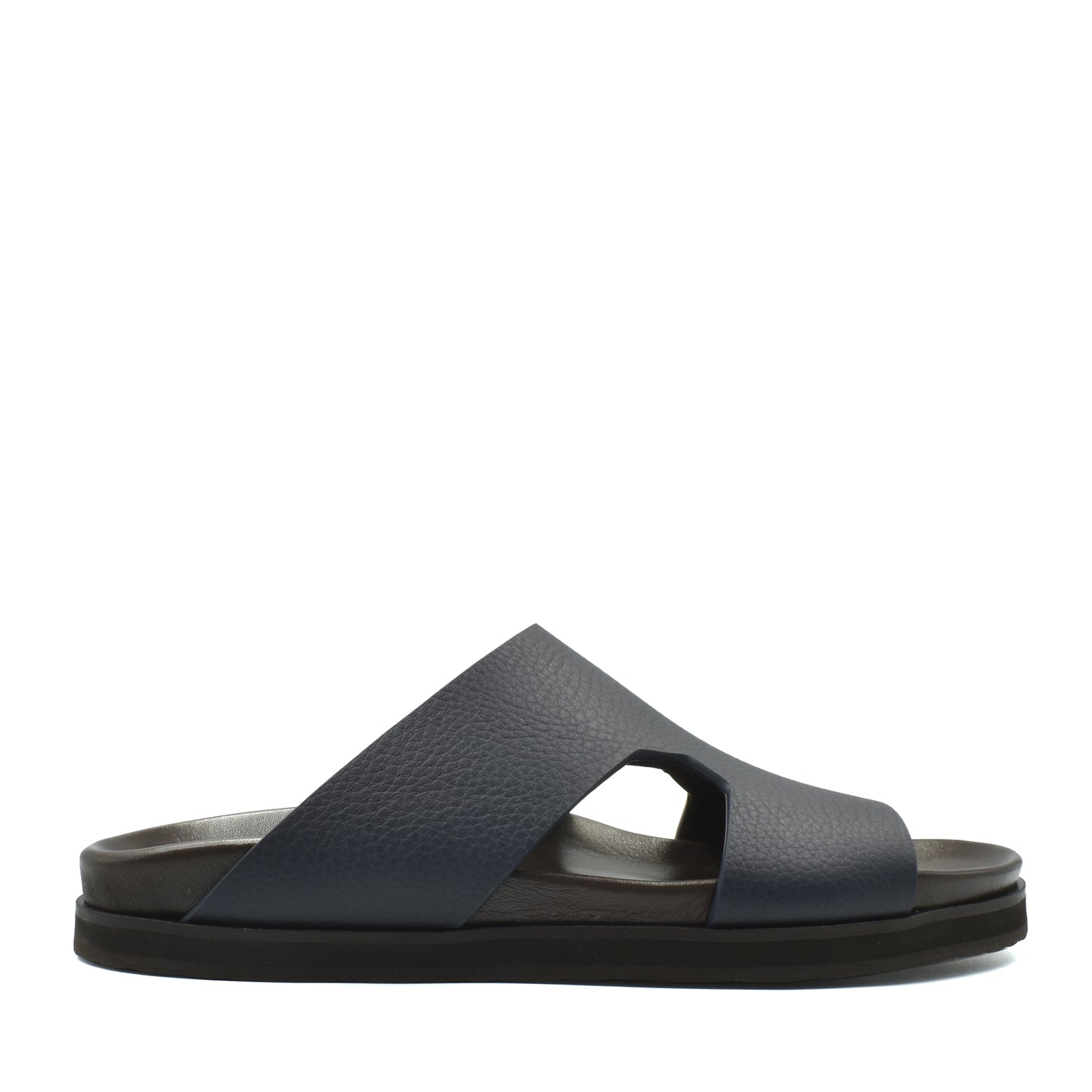 Side view of navy blue luxury leather sandals with wide cross straps and cushioned sole