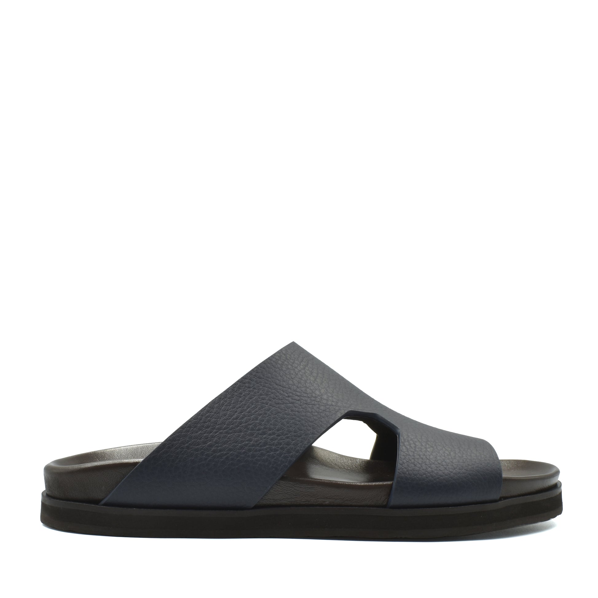 Side view of navy blue luxury leather sandals with wide cross straps and cushioned sole
