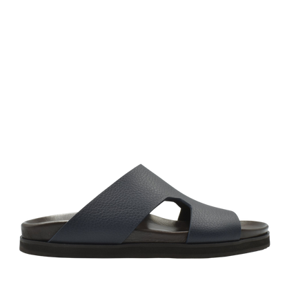 Side view of navy blue luxury leather sandals with wide cross straps and cushioned sole