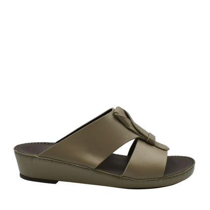 Taupe luxury leather sandals with a wide strap and decorative knot detail in slide design