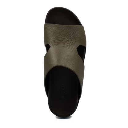 Top view of luxury leather sandals in olive green with black sole from private collection