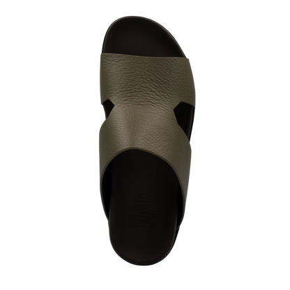 Top view of luxury leather sandals in olive green with black sole from private collection