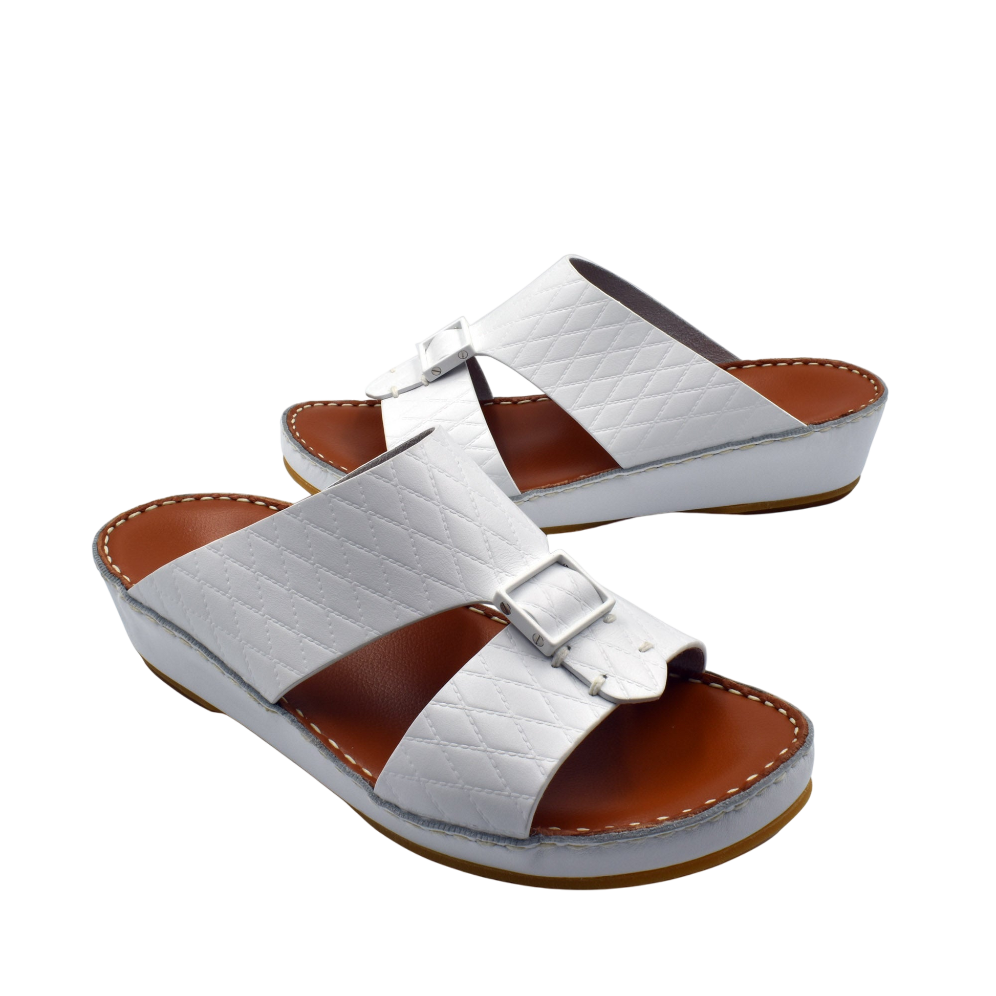 White luxury leather sandals with quilted straps and buckle detail on brown cushioned sole