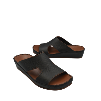Black luxury leather slide sandals with cushioned sole for comfortable wear