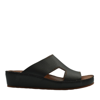 Black luxury leather slide sandals with cushioned sole and open toe design from Private collection