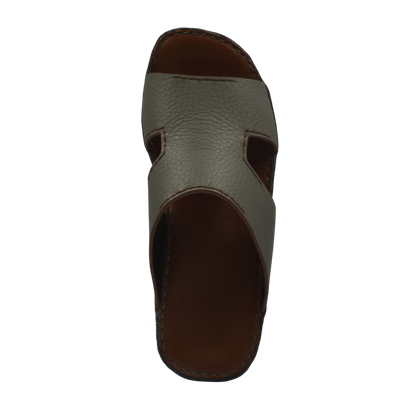 Top view of luxury leather slide sandals in brown with textured leather and cushioned sole