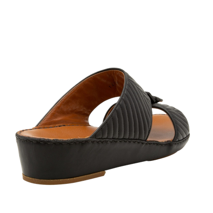 Black luxury matelasse footwear slide sandal with quilted design and low wedge heel