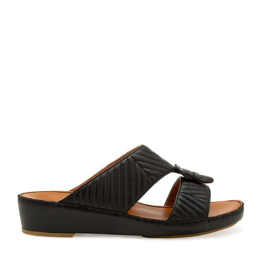 Black luxury matelasse footwear slide sandal with quilted straps and low wedge heel