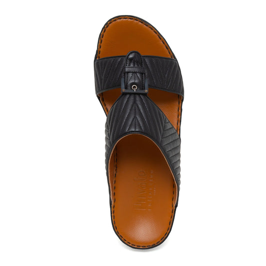 Black luxury matelasse footwear slide sandal with quilted leather straps and brown cushioned footbed