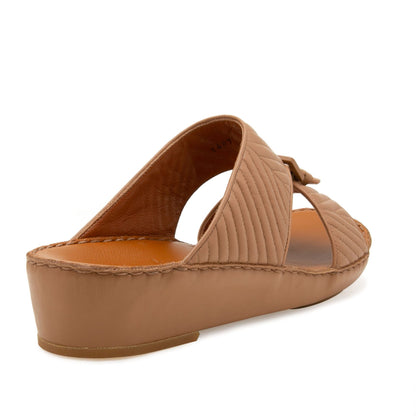 Brown luxury matelasse footwear slide sandal with quilted straps and a low wedge heel