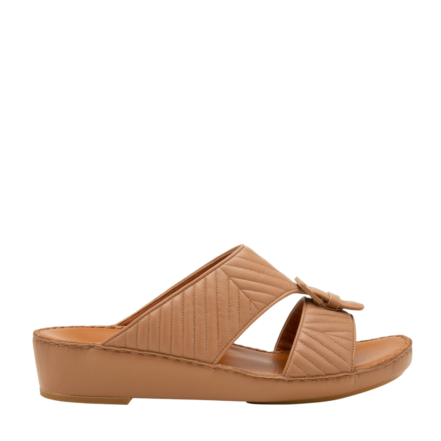 Tan wedge slide sandals featuring luxury matelasse footwear design with quilted straps and buckle detail