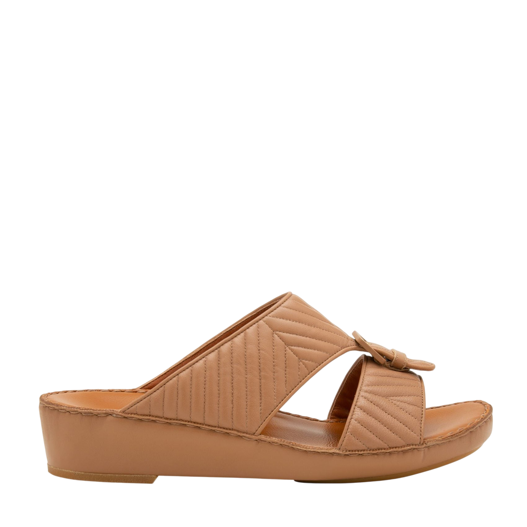 Tan wedge slide sandals featuring luxury matelasse footwear design with quilted straps and buckle detail