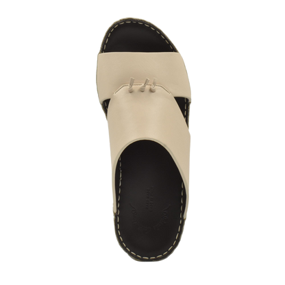 Top view of a beige luxury nappa leather sandal with black sole and contrast stitching