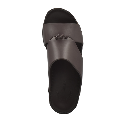 Top view of a luxury nappa leather sandal in dark brown with a stitched crossover strap design