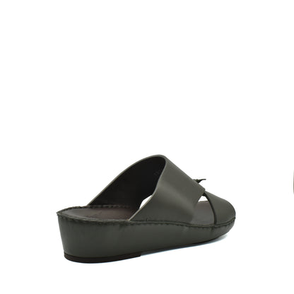 Side view of a gray luxury nappa leather sandal with a wedge sole from Private collection