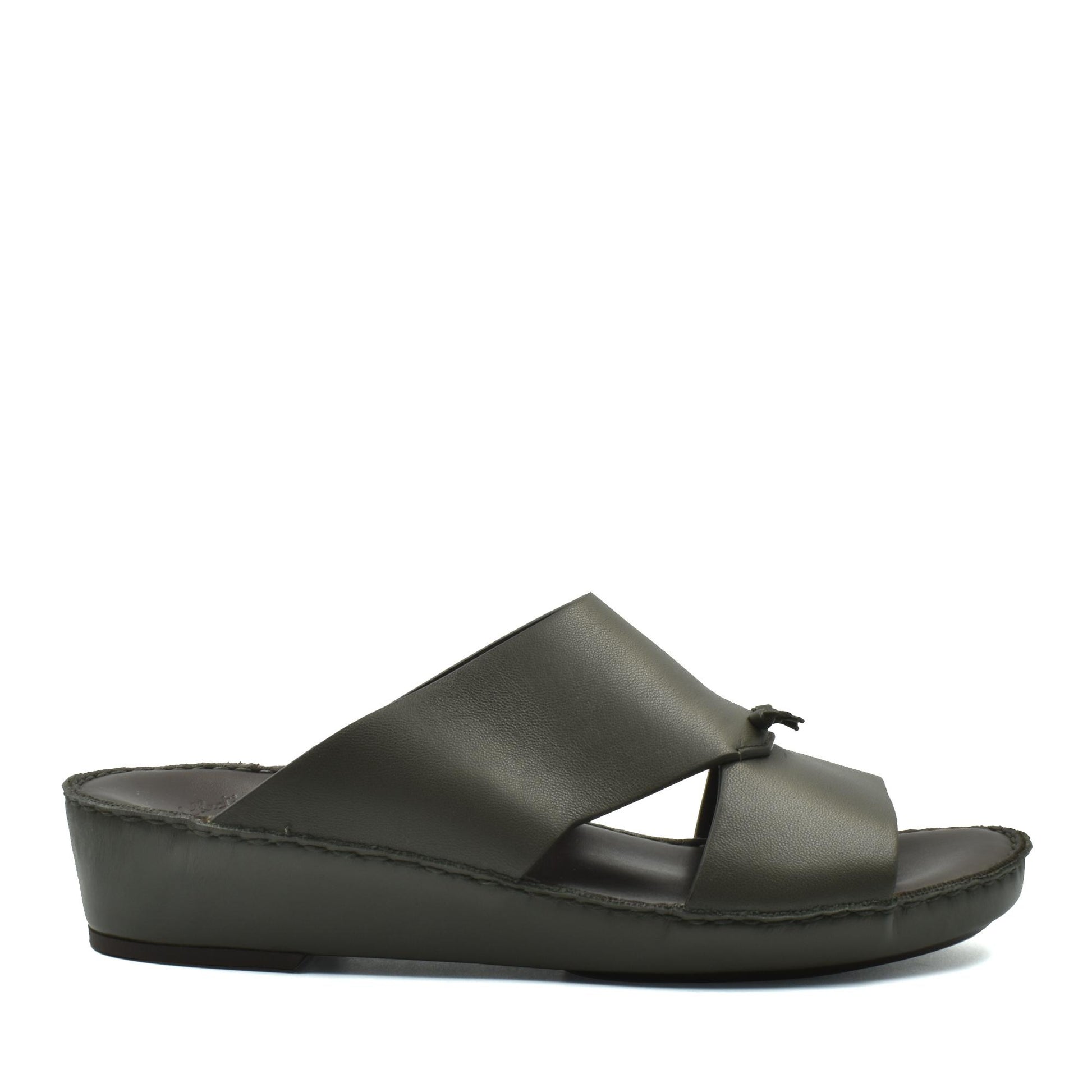 Side view of luxury nappa leather sandal in dark olive with cross strap design and comfortable sole