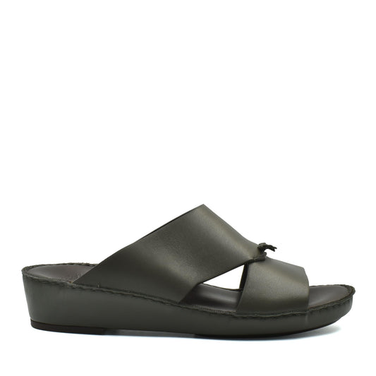 Side view of luxury nappa leather sandal in dark olive with cross strap design and comfortable sole