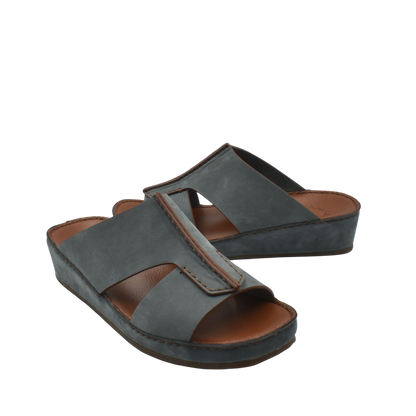 Gray luxury nubuck slides with cushioned brown footbed and open toe design