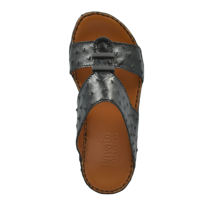 Black luxury ostrich sandals with textured leather and brown cushioned footbed from Private collection
